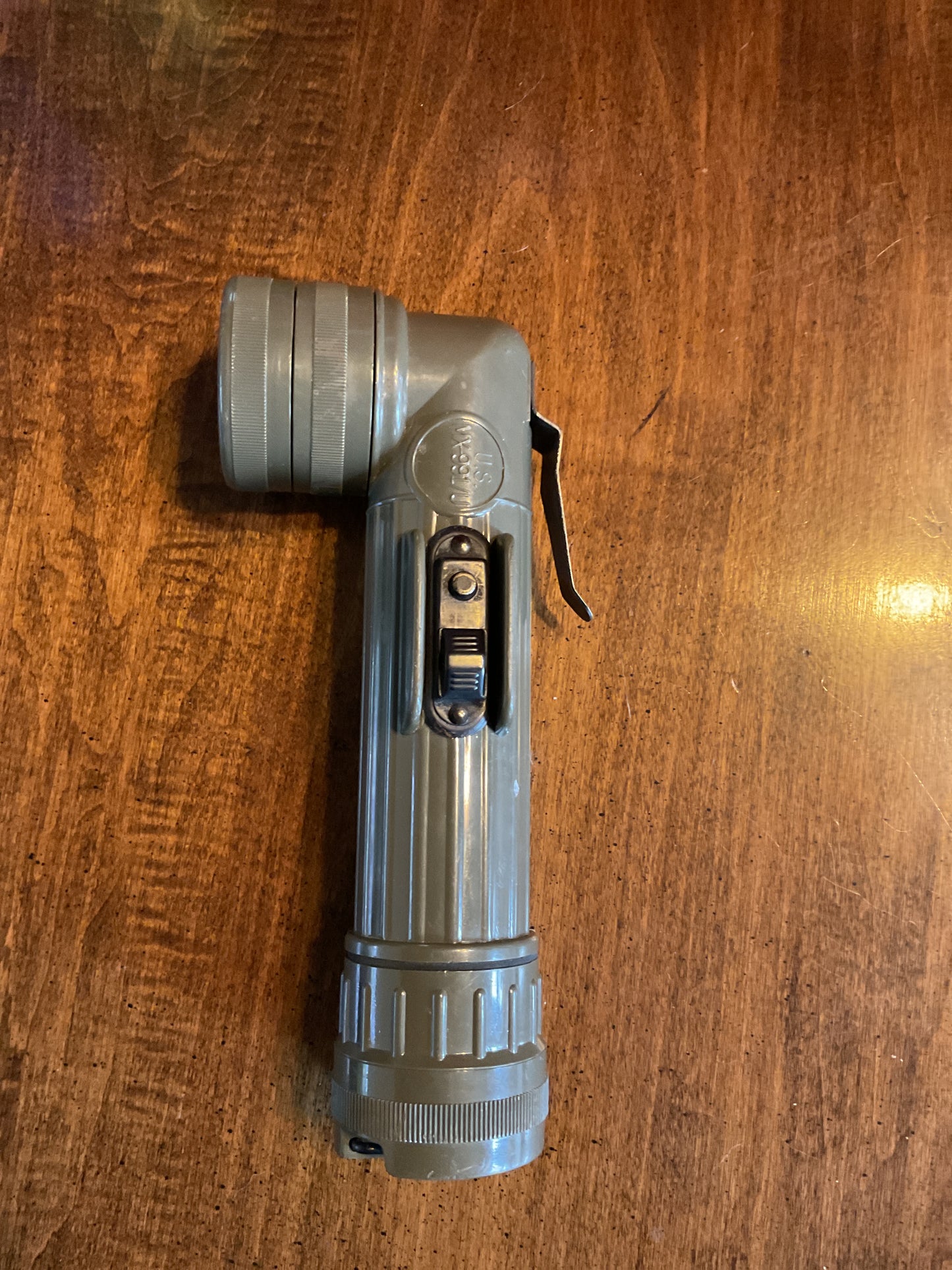 Used military flashlight